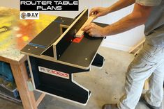 a man is using a router table to build a desk