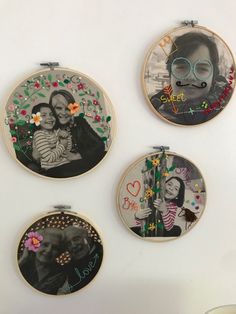 three embroidery hoop pictures hanging on the wall