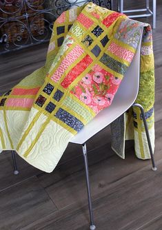 a chair that has a quilt on it