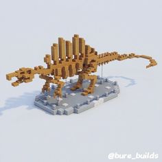 a lego model of a dinosaur on top of snow