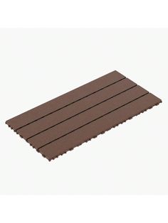 a brown mat that is laying on the ground