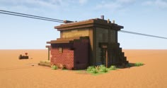 a small brick building in the middle of an arid area with power lines above it