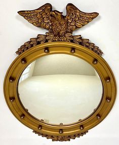 a mirror with an eagle on the front