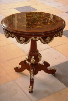 an ornately decorated table on a tiled floor