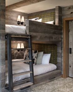 the bunk beds are made from wood and have pillows on them