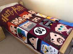 a bed with a harry potter blanket on it