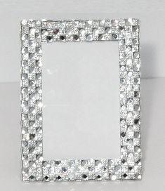 a square diamond frame on a white surface