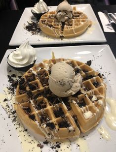 two plates with waffles and ice cream on them