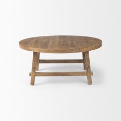 a round wooden table with two legs on the top and one leg raised to the side