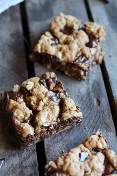 chocolate chip cookies and oatmeal squares on a wooden table