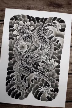 a black and white drawing of a dragon with clouds in the background on a piece of paper