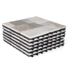 a stack of tiles sitting on top of each other in front of a white background