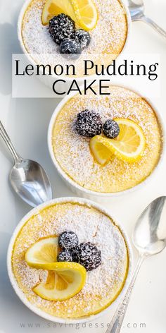 two lemon pudding cakes with powdered sugar and fresh berries on top, served in white bowls