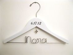 a white coat hanger with the word mono on it