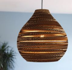 a hanging light made out of woven material