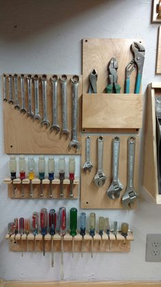 there are many tools hanging on the wall