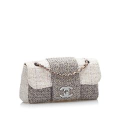 This stylish Chanel CC flap shoulder bag features a tweed body, silver-tone chain straps connected with a brown leather strap, a flap with interlocking Cs and a twist closure, and slip pockets inside. The Bag can be stylishly worn over the shoulder. Beige Purses, Chanel Tweed, Grey Tweed, Leather Weaving, Brown Leather Strap, Fashion Icon, Cc Logo, Early 1900s, Coco Chanel