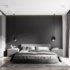 a large bed sitting in the middle of a bedroom next to a wall mounted lamp