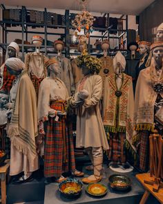 many mannequins are dressed in traditional clothing