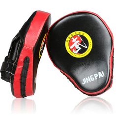 two black and red boxing gloves with the logo of an official thai martial team on it