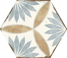 a white and brown tile with blue leaves on the bottom, in an octagonal pattern