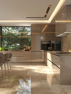 a modern kitchen and dining room with large windows