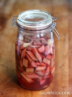 there is a jar full of pickled vegetables on the table with text overlay