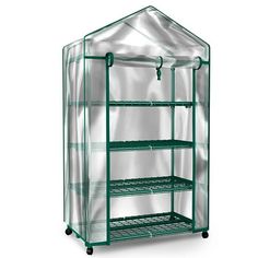 a green house with shelves and wheels on the bottom shelf, in front of a white background