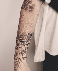 a person with a flower tattoo on their arm