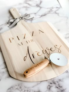 "Personalized Pizza Kit, Custom Engraved Pizza Peel, Housewarming Gift Basket, Real Estate Closing Gift Basket, Father's Day Gift for Dad All items are engraved with an industrial grade laser- ensuring they last a lifetime!  Board is 22\" x 12\" and is made of Poplar Wood Please include the name you would like engraved on the board \"Pizza at the ...\" will automatically be included unless otherwise specified.  Hello and Welcome to my BRAND NEW SHOP! I have been on Etsy since 2017 running my other shop Theba Outfitters! We have over 5000 sales and 800 5-Star Reviews! Check us out at https://www.etsy.com/shop/ThebaOutfitters for all your baby and toddler apparel needs! I have expanded my Theba brand to Theba Handmade personalized Farmhouse Decor and Gifts!  Questions? Message me any time! T Glowforge Gifts For Dad, Personalized Closing Gifts For Buyers, Pizza Kit Gift Basket, Pizza Making Gift Basket, Pizza Basket Ideas Gift, Pizza Gift Basket Ideas, Pizza Gift Basket, Closing Day Real Estate, Wood Engraving Ideas