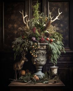 a vase filled with flowers and antlers on top of a table