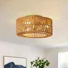 a living room filled with furniture and a chandelier hanging over the top of it