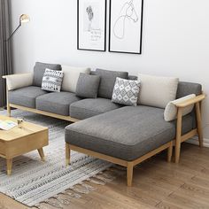 a living room filled with furniture and pictures on the wall