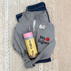 We bundled our bestselling custom teacher tumbler and teacher earrings with a new personalized teacher sweatshirt quarter zip. Have the perfect teacher appreciation gift with this custom embroidered teacher sweater set! *If you need this by a certain date, please check the estimated shipping provided at the bottom of the description to make sure it will arrive on time or reach out for rush shipping options* HOW TO ORDER: 1. Select quarter zip size AND color 2. Select Add On options 3. In persona Teacher Sweater Ideas, Teacher Sweatshirt Ideas, Daycare Teacher Gifts, Teacher Sweater, Teacher Accessories, Teacher Earrings, Daycare Teacher, Teacher Tumbler, Preschool Gifts