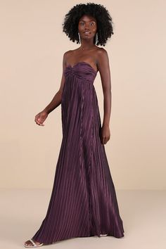 Lovely memories are always made more magical with the Lulus Whimsical Beauty Dark Purple Satin Plisse Strapless Maxi Dress! Plisse pleated woven satin shapes this exquisite dress that features a sweetheart neckline (with hidden no-slip strips) and a strapless, bow-inspired bodice. An empire-style waist that sits atop an A-line skirt that ends at a sweeping maxi hem. Hidden back zipper/clasp. Fit: This garment fits true to size. Length: Floor length. Size medium measures 50.5" from top to bottom. Bust: Works best for A to C cup sizes - consider sizing up for fuller bust. Waist: Not Fitted - comfortable room throughout midsection. Hip: Not Fitted - fuller skirt allows room for hips. Undergarments: May be worn with a strapless bra, adhesive bra, petals, or no bra. Fabric: Fabric has no stretc Pleated Top Dress, Pleated Dress Formal, Holiday Formal Dresses, Purple Maxi, Purple Maxi Dress, Adhesive Bra, Strapless Maxi, Purple Satin, Black Tie Wedding