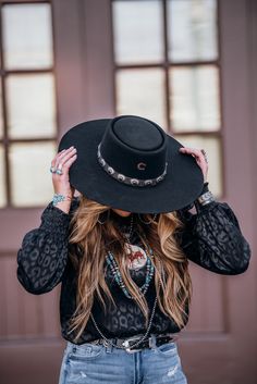 The hat is made from wool and features an embellished concho design hat band. The gambler crown measures 4". The 4 1/4" brim will shade your eyes so you can look and feel cool. Wear this hat to complete the perfect western outfit. Sized fit Hat band embellished with concho design Wool felt fabric 4" gambler crown Made Black Charlie 1 Horse Hat Outfit, Gambler Hat Outfit, Fancy Western Outfits Party, Charlie Horse Hats Outfit, Charlie One Horse Hats Outfit, Black Cowboy Hat Outfit Woman, Sage Photoshoot, All Black Cowgirl Outfit, Western Office Outfits