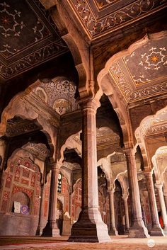 an intricately decorated building with pillars and arches