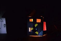 a paper lantern is lit up in the dark