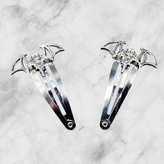 Bat Hair Clips - Unleash Your Gothic Glamour! 🦇 Elevate your style with these bewitching Metal Bat Hair Clips, meticulously crafted by Extra Kitsch. The set of two captures the essence of whimsy and gothic charm, adding a touch of mystery to your ensemble. Your choice of silver or bronze. Themed Adjustable Hair Accessories For Gifts, Adjustable Gothic Hair Accessories For Halloween, Adjustable Halloween Costume Hair Accessories, Adjustable Hair Accessories For Halloween Costume, Halloween Costume Hair Accessories, Hair Clips Silver, Gothic Glamour, Metal Bat, Gothic Hairstyles