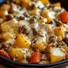 a close up of a casserole dish with meat and vegetables