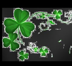 four leaf clovers are flying in the air