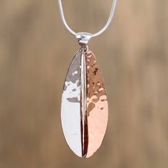 Rippling like lake waters a modern leaf is crafted by hand of sterling silver and copper with a hammered finish. Mexican artisan Guillermo Arregui works in the time-honored tradition of Taxco silversmithing to create this beautiful pendant necklace. The leaf pendant is formed of two pieces that dangle separately. Hammered Copper Jewelry, Silver Braided Bracelet, Modern Silver Earrings, Beautiful Pendant Necklace, Silver Dangle Earrings, Copper Pendant, Sterling Silver Dangle Earrings, Copper Necklace, Copper Pendants