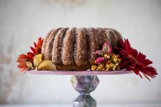 a bundt cake on a pink plate with flowers