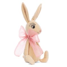 a stuffed rabbit with a pink bow around its neck