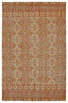 an orange and beige rug with diamond shapes