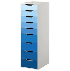 a tall blue and white cabinet with five drawers