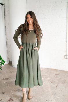 Experience understated elegance with the "Harvest Breeze Long Sleeve Dress." This versatile piece features a classic scoop neckline and long fitted sleeves that transition into a flowy gathered skirt. With its earthy olive hue and flattering empire waistline, this dress is the perfect blend of casual comfort and timeless sophistication. Ideal for layering or wearing on its own, it’s a must-have for cooler seasons. Fabric: 95% Spandex, 5% Cotton Product Details: Scoop neckline Long fitted sleeves Mid Length Dresses Casual, Farmgirl Outfits, Simple Modest Outfits, Prairie Fashion, Loungewear Dresses, Nails Natural, Layered Long Sleeve, Louisa May Alcott, Empire Waistline