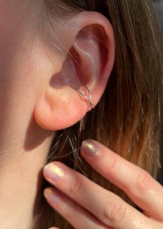 These ear cuffs are made with .925 sterling silver wire; available individually or as a pair.  To put on ear, gently slide into place. Can be adjusted slightly by carefully pressing or pulling on the ear cuff for a better fit, but be careful not to push or pull too hard or too quickly! Every item is smoke cleansed with patchouli and lavender before being packaged with care✨ To keep your ear cuff looking its best do not wear while swimming or bathing. As a general rule - your jewelry should be the last thing you put on while getting ready for the day and the first thing you take off at the end of the day! ✨Cleaning tips for sterling silver will be included with your purchase.  ✨Photo quality/color: I use natural lighting to take my product photos, and try to get a proper depiction of what t Cuff Earrings No Piercing, Earring Cuff, Minimalist Ear Cuff, Wrap Earrings, Silver Ear Cuff, Natural Lighting, Ear Cuffs, Cuff Earrings, Product Photos