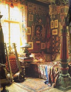 an ornate bedroom with lots of furniture and paintings on the walls