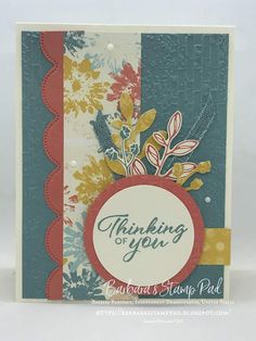 a close up of a greeting card with flowers on the front and bottom, which reads thinking about you